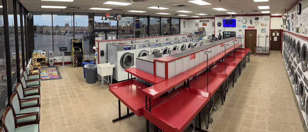 Bright seating and folding space inside Laura's Laundromat