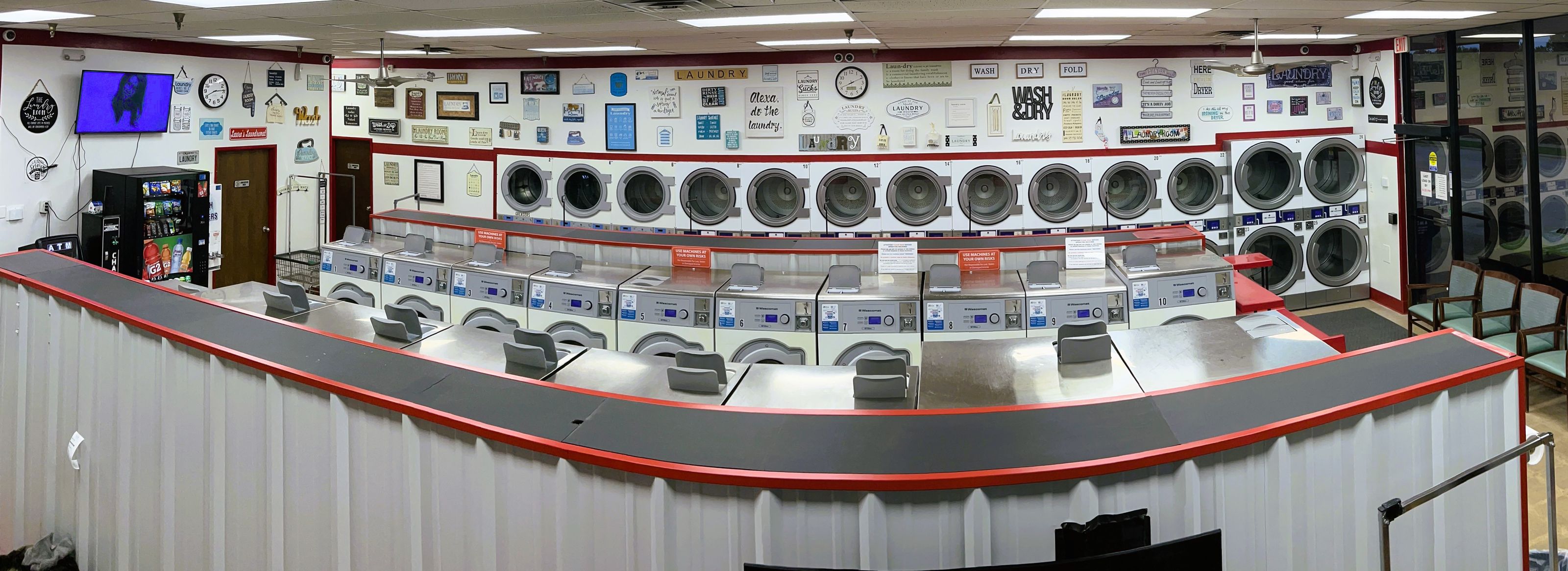 Panorama of the main floor, rows of washers and dryers